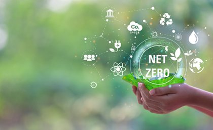 Image: Adobe A hand holding a Net Zero graphic